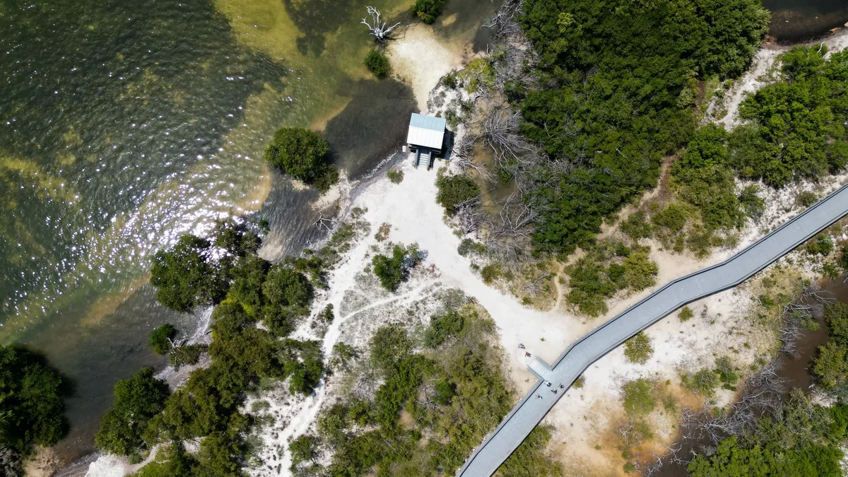 Aerial view of the real Florida Everglades coastline — the geography Leonida is based on.