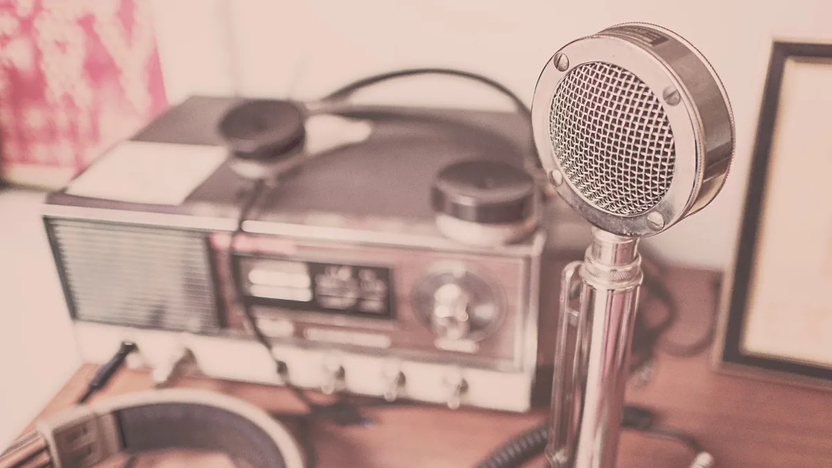 A vintage microphone and radio set — illustrative of broadcast, not GTA 6 footage.